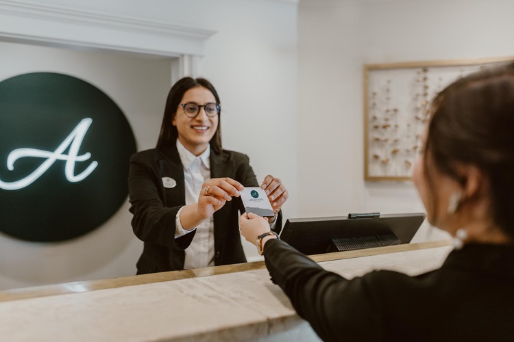 Woman checking into hotel 