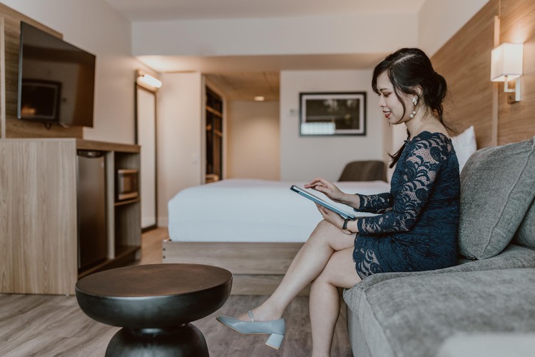 Woman sitting on sofa in room